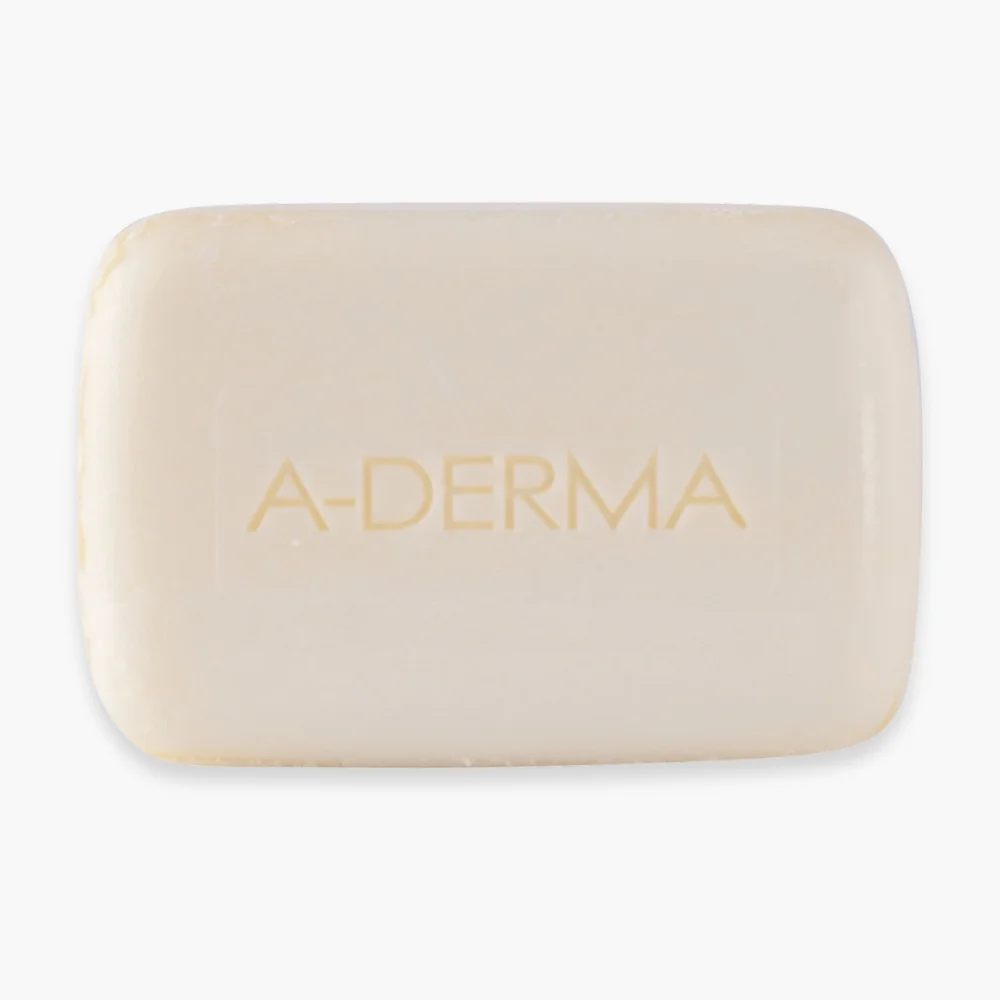 a-derma-pain-surgras-nutritif-100g.jpg Pain surgras A-Derma ivoire rectangulaire gravé du nom de la marque