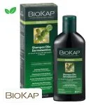 Flacon et étui verts Biokap Bellezza shampooing-huile apaisant, olives illustrées