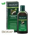Flacon et étui verts Biokap Bellezza shampooing noir détoxifiant, charbon illustré