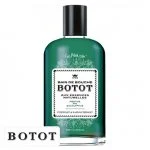 Flacon vert de bain de bouche Botot, étiquette blanche et bouchon noir