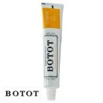 Tube blanc de dentifrice Botot avec bandeau jaune et bouchon blanc