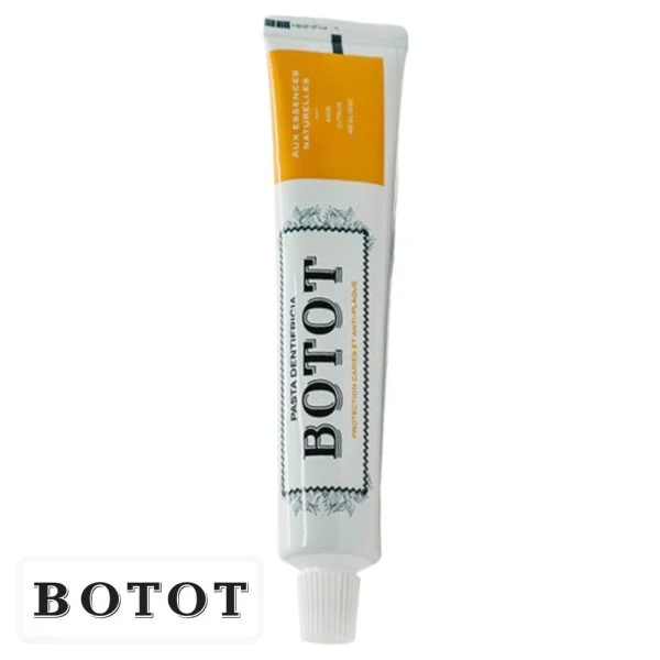 Tube blanc de dentifrice Botot avec bandeau jaune et bouchon blanc