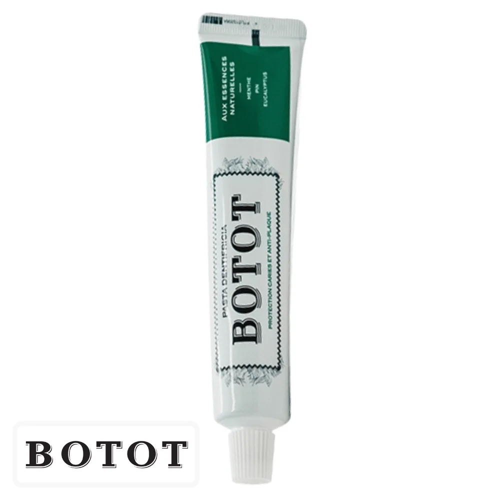 botot-dentifrice-protection-carries-et-anti-plaque-menthe-pin-et-eucalyptus-75ml.jpg Tube blanc de dentifrice Botot avec bandeau vert et bouchon blanc