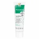 Tube blanc et vert de dentifrice Blancheur au miel de Manuka IAA15+