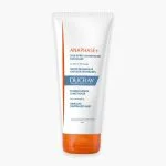 Tube blanc à capuchon orange Ducray Anaphase+ après-shampooing fortifiant
