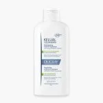 Flacon blanc Ducray Kelual Squanorm shampooing pellicules grasses 200 ml