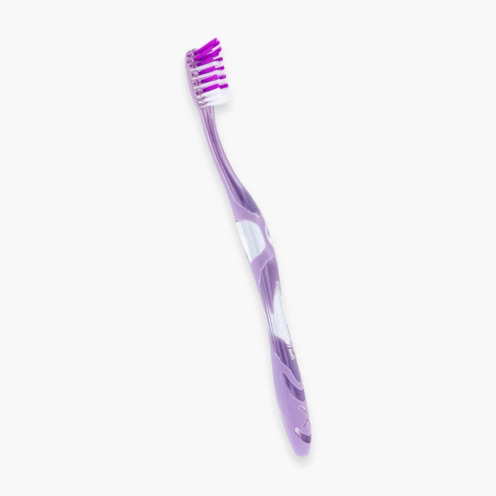 elgydium-brosse-a-dents-anti-plaque-souple-1u.jpg Brosse à dents Elgydium Anti-Plaque manche violet filaments parme et blancs