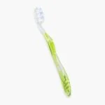Brosse à dents Elgydium Blancheur manche vert translucide filaments blancs bleutés