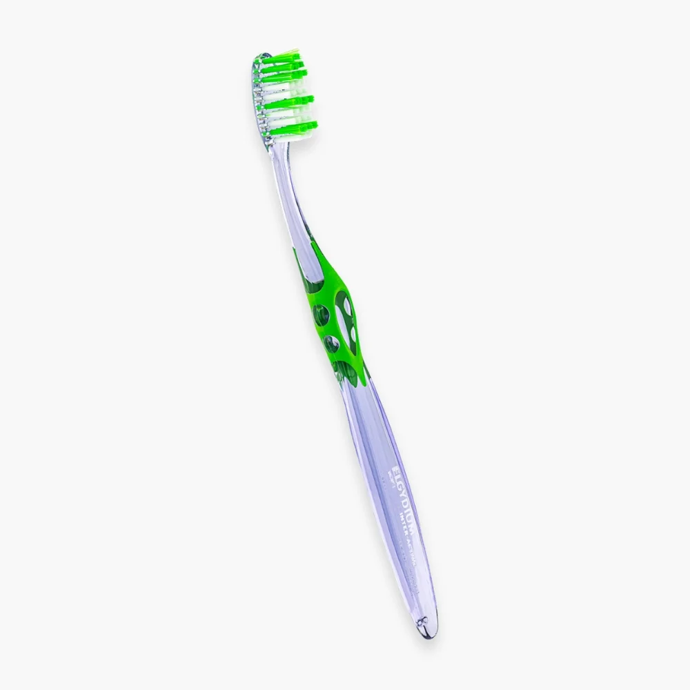 elgydium-brosse-a-dents-interactive-souple-1u.jpg Brosse à dents Elgydium Inter-Active souple, manche transparent et insert vert