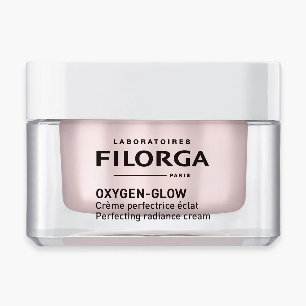 filorga-oxygen-glow-creme-perfectrice-eclat-50ml.jpg Pot transparent Filorga Oxygen-Glow, crème perfectrice d'éclat, texture rosée, 50 ml
