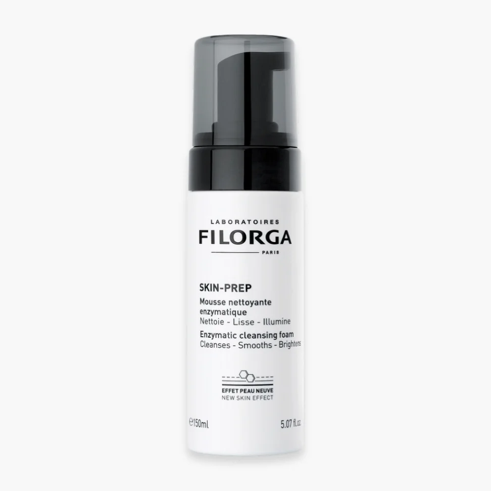 filorga-skin-prep-mousse-nettoyante-enzymatique-150ml.jpg Flacon pompe blanc Filorga Skin-Prep, mousse nettoyante enzymatique, bouchon noir, 150 ml