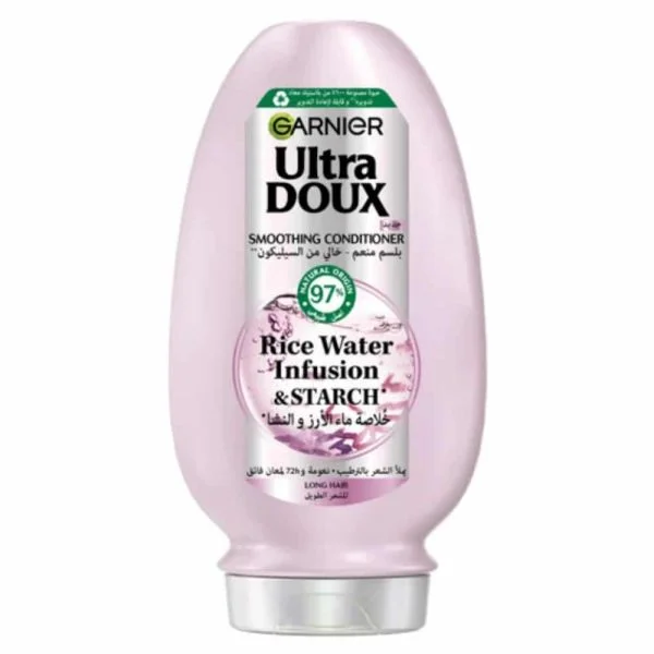 Flacon rose Garnier Ultra Doux après-shampoing lissant eau de riz et amidon