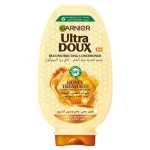 Flacon ambré Garnier Ultra Doux après-shampoing Trésor de Miel acacia et cire