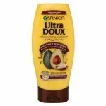 Flacon jaune Garnier Ultra Doux Après-Shampooing Huile d'Avocat et Karité