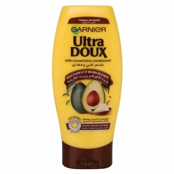 Flacon jaune Garnier Ultra Doux Après-Shampooing Huile d'Avocat et Karité