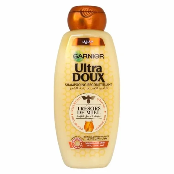 Flacon doré Garnier Ultra Doux shampooing reconstituant Trésors de Miel