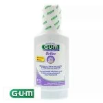 Flacon blanc du bain de bouche GUM Ortho portant la mention 0 % alcool