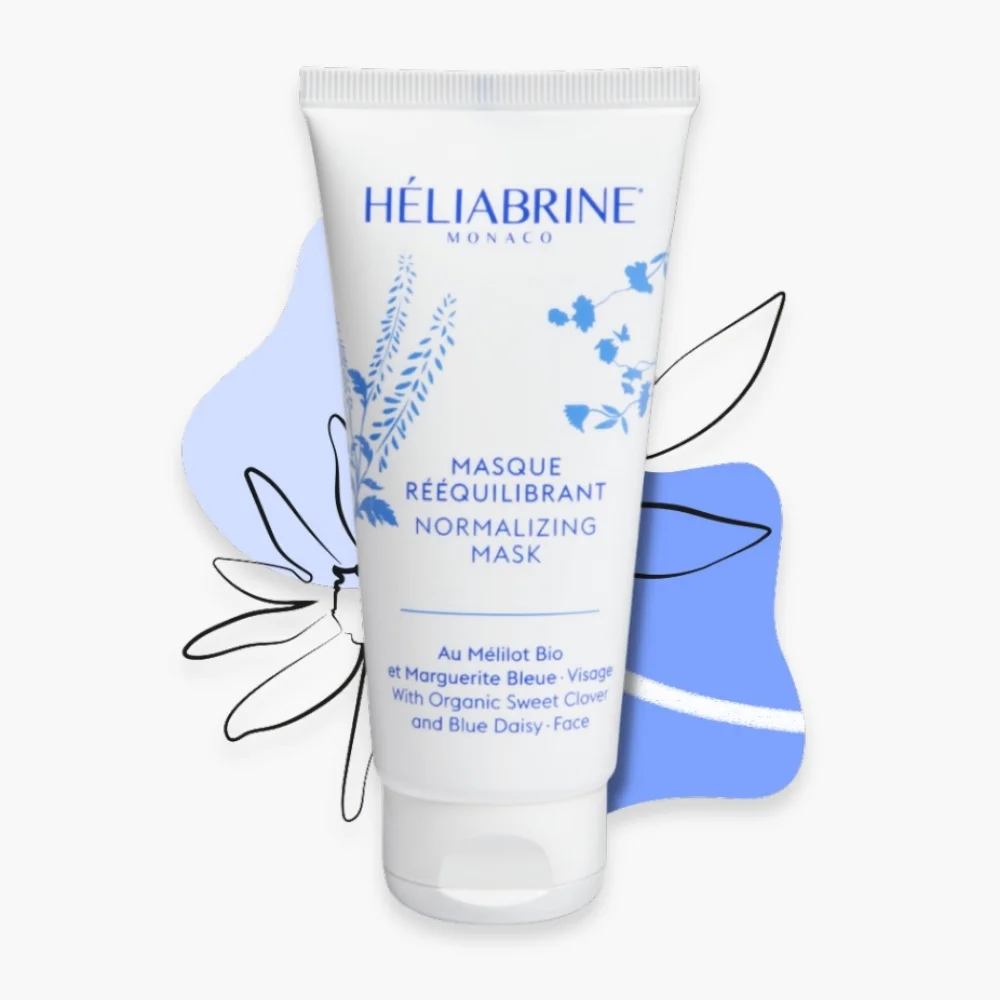 heliabrine-masque-reequilibrant-75ml.jpg Tube blanc et bleu Héliabrine masque rééquilibrant 75 ml, motifs floraux