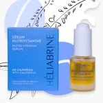 Flacon compte-gouttes doré et étui bleu Héliabrine sérum nutri-vitaminé