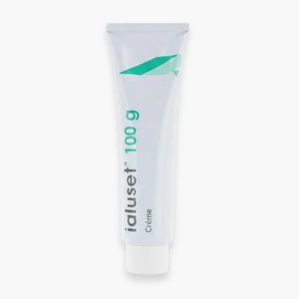 Tube blanc et vert Ialuset crème 100 g posé sur fond clair