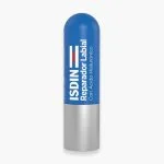Stick bleu ISDIN Reparador Labial, capuchon argenté, baume à lèvres réparateur