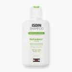 Flacon blanc ISDIN Shampoo Nutradeica pellicules grasses 200 ml, bandeau vert