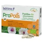 Boîte orange Ladrôme Pastilles Propolis avec fleurs d'hibiscus et pastilles devant
