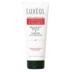 Tube blanc Luxéol après-shampooing cheveux colorés, bandeau rouge, bouchon vert