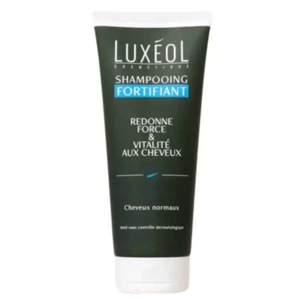Tube vert foncé Shampooing Fortifiant Luxéol, bandeau bleu, bouchon blanc
