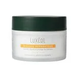 Pot blanc givré Masque Réparateur Luxéol, couvercle vert foncé, bandeau orange