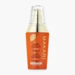 Flacon pompe orange Makari Extrême Argan et Carrot Oil, sérum correcteur anti-taches