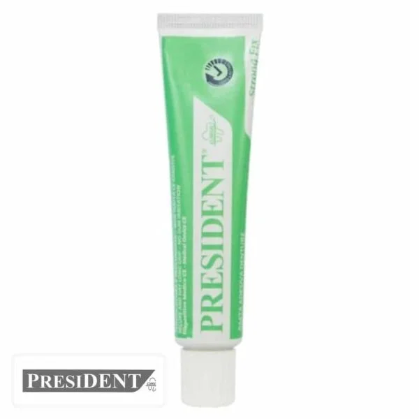 Tube vert de crème adhésive dentaire President Strong Fix