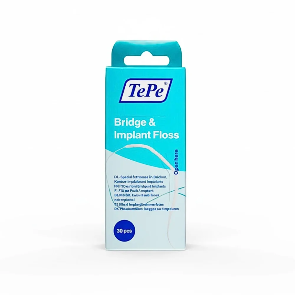 tepe-tepe-fil-dentaire-pour-bridge-et-implant-30u.jpg Boîte turquoise fil dentaire TePe Bridge and Implant Floss, 30 brins