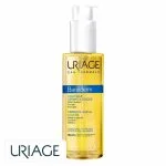 Flacon-pompe transparent d'huile dorée Uriage Bariéderm CICA-huile dermatologique