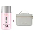 Flacon rose du fluide UV Glycolic-Bright SPF50+ L'Oréal Paris et trousse grise