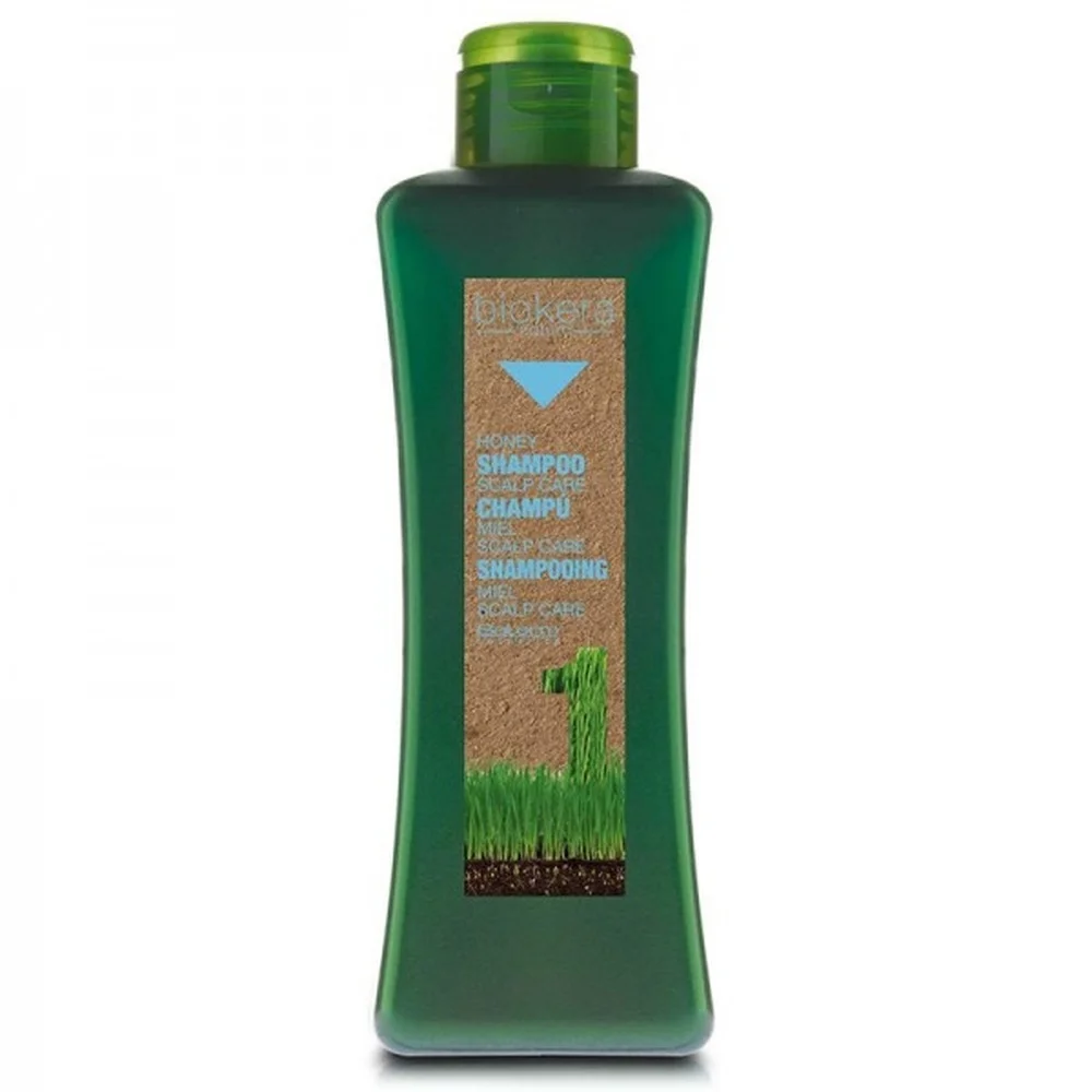 biokera-nature-shampooing-scalp-care-miel-300ml.jpg Flacon vert Biokera shampooing miel Scalp Care, étiquette kraft lettres bleues