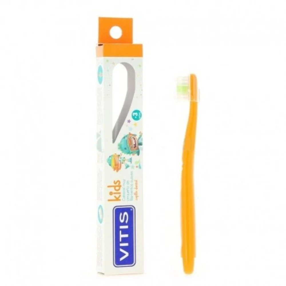 Vitis Brosse a dent Kids +3ans Brosse à dents Vitis Kids orange avec capuchon, posée près de son étui