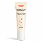 Tube beige Embryolisse soin correcteur anti-cernes teinte rose bouchon blanc